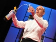 Michael Pritchard demonstrates the Lifesaver water-purification bottle during a TED talk